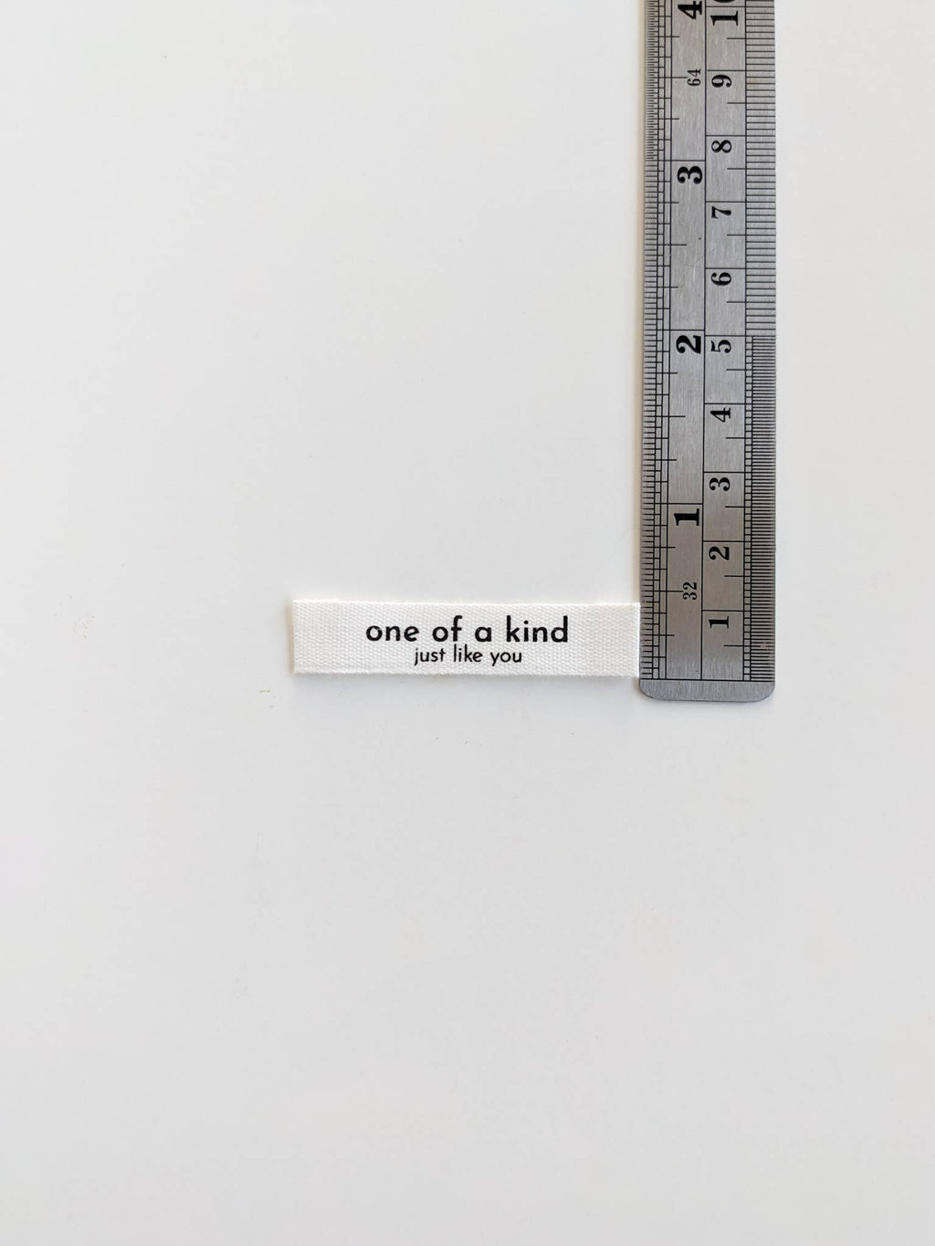 Sy-inn Merkelapper Bomull "One of a Kind, Just Like You"